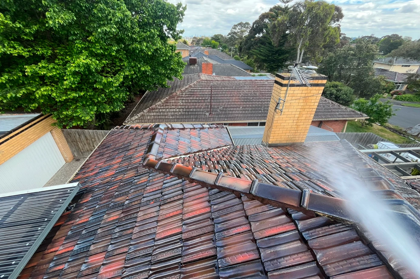 Pressure washing roof